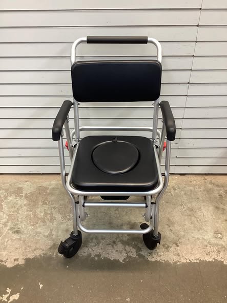 Costway 4-in-1 Foldable Bedside Commode Chair with Brakes and Bucket and Footrest