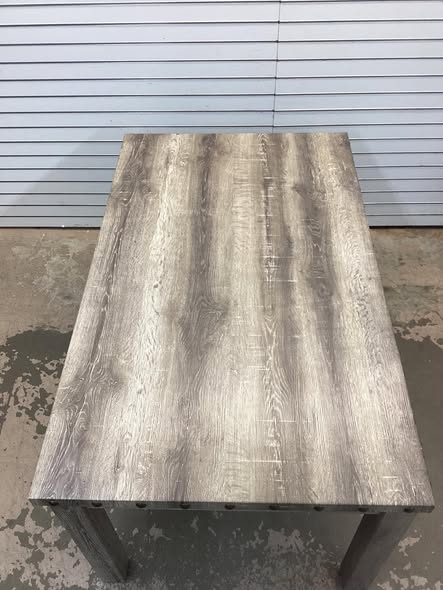 Fort Rustic Wood Dining Table with Rivets and Distressed Texture