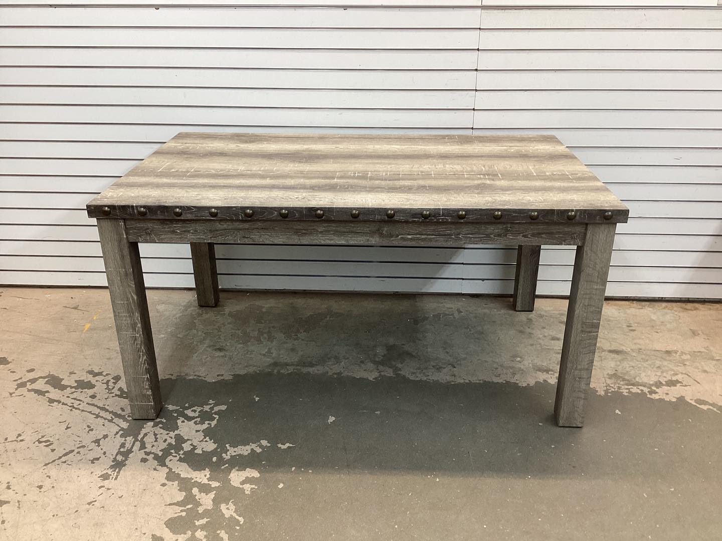 Fort Rustic Wood Dining Table with Rivets and Distressed Texture