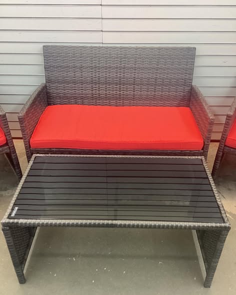Costway 4 -Piece Rattan Patio Conversation Set with Red Cushions.